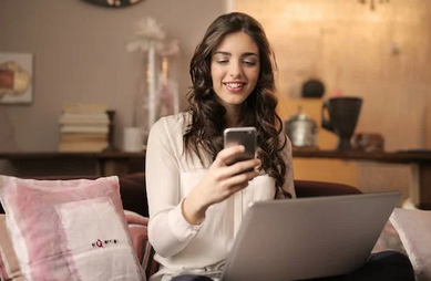 woman distracted from work with phone