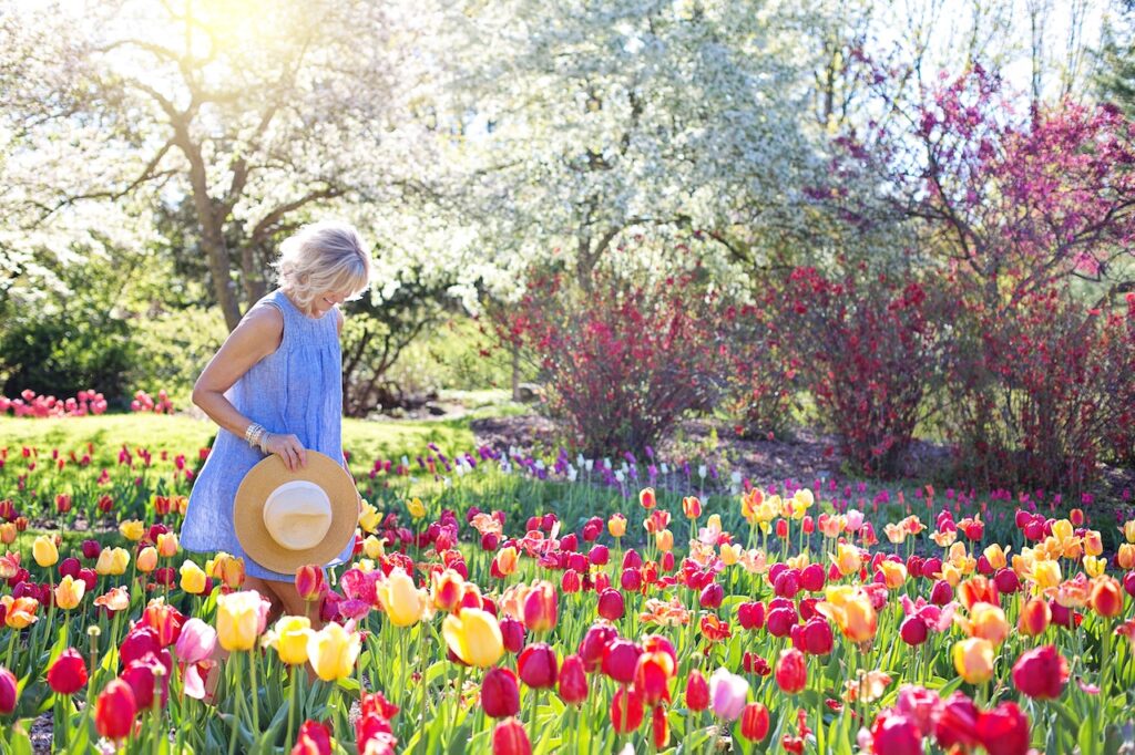 Woman walking through flowers