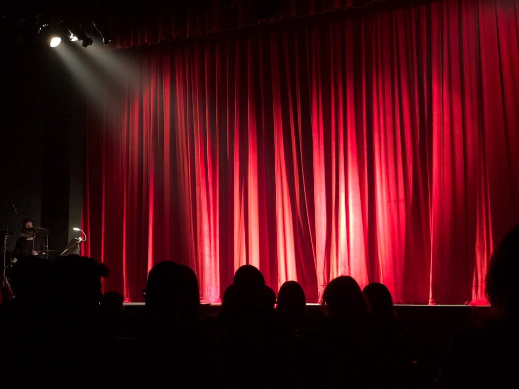 Red stage curtain with lighting