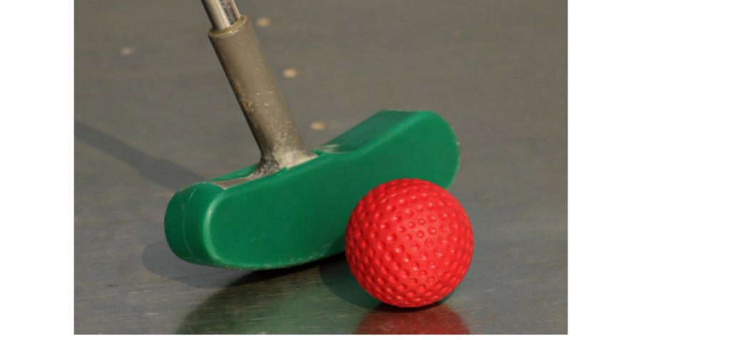 Mini golf putter with red golfball 