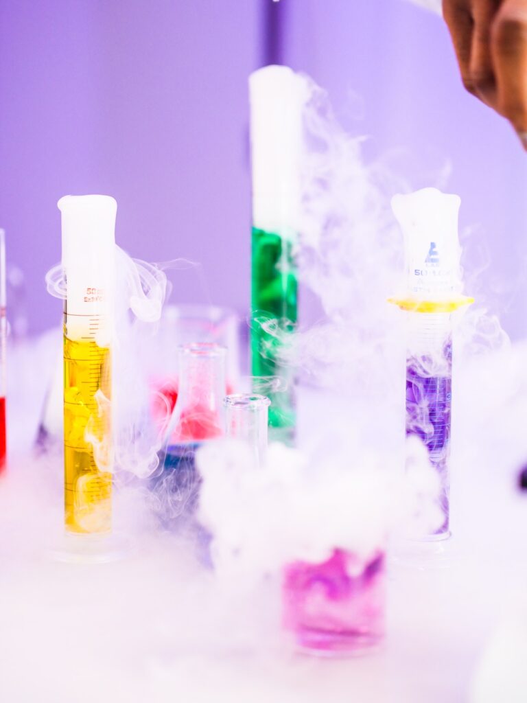 Colorful beakers with smoke