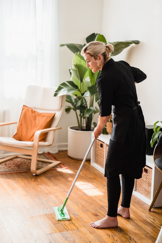 Woman mopping hardwood floor